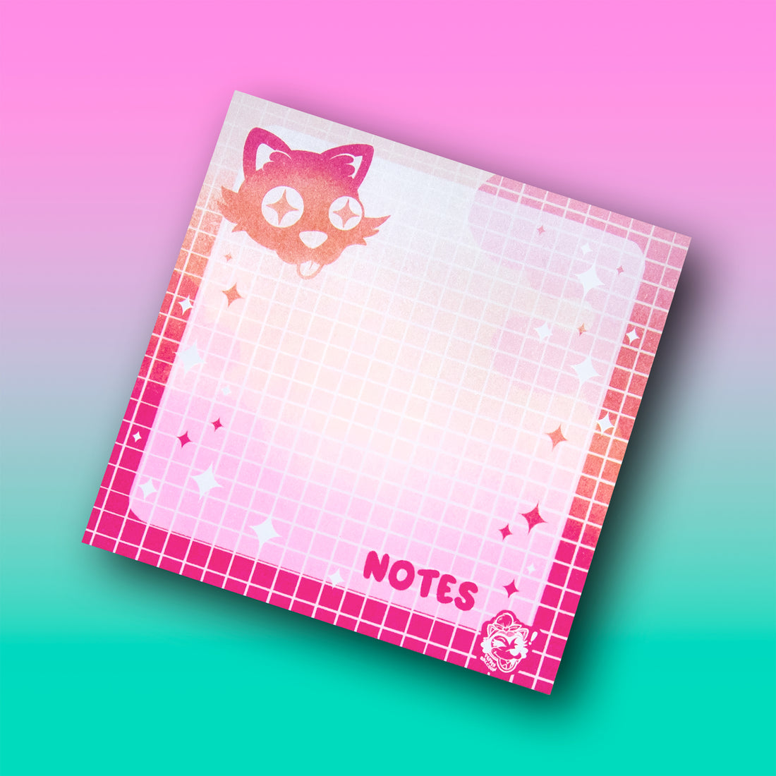 A flatlay of grid-layout sticky notes featuring a cute black cat sticking its tongue out and the word Notes.