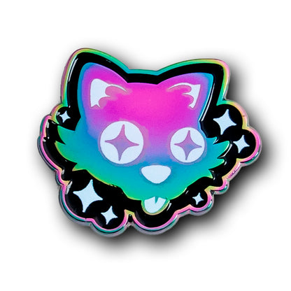 A rainbow anodised enamel pin of a silly cartoon cat, with starry eyes sticking out its tongue. It is surrounded by white sparkles on a black background.